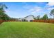 Large backyard with lush grass and wooden fence at 4041 Oxeye Loop, Johns Island, SC 29455