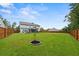 Large backyard with lush grass and wooden fence at 4041 Oxeye Loop, Johns Island, SC 29455