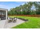 Relaxing backyard patio with seating area and wood fence at 4041 Oxeye Loop, Johns Island, SC 29455