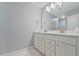 Bathroom with double vanity and white cabinets at 4041 Oxeye Loop, Johns Island, SC 29455