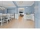 Bright entryway with hardwood floors and view into dining room at 4041 Oxeye Loop, Johns Island, SC 29455