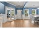 Light hardwood floors in entryway with view into dining area and office at 4041 Oxeye Loop, Johns Island, SC 29455