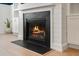 Close-up view of a modern fireplace with a dark stone surround at 4041 Oxeye Loop, Johns Island, SC 29455