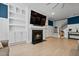 Living room fireplace with built-in shelving and mantel at 4041 Oxeye Loop, Johns Island, SC 29455
