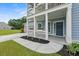 Front porch with rocking chairs, white railing, and flower planters at 4041 Oxeye Loop, Johns Island, SC 29455
