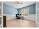 Home office with wood-look floors, built-in shelving, and large window at 4041 Oxeye Loop, Johns Island, SC 29455