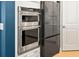 Double oven and french door refrigerator in a modern kitchen at 4041 Oxeye Loop, Johns Island, SC 29455