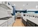 Modern kitchen features white cabinets, stainless steel appliances, and a breakfast bar at 4041 Oxeye Loop, Johns Island, SC 29455
