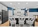 Modern kitchen with white cabinets, stainless steel appliances, and an island at 4041 Oxeye Loop, Johns Island, SC 29455