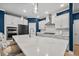 Modern kitchen with white cabinets, stainless steel appliances, and quartz countertops at 4041 Oxeye Loop, Johns Island, SC 29455