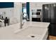 Modern kitchen sink and faucet on a large quartz island at 4041 Oxeye Loop, Johns Island, SC 29455