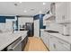 Spacious kitchen with white cabinets, stainless steel appliances, and a large island at 4041 Oxeye Loop, Johns Island, SC 29455