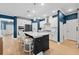 Open kitchen boasts white cabinets, an island, and stainless steel appliances at 4041 Oxeye Loop, Johns Island, SC 29455