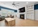 Living room with hardwood floors, fireplace, and built-ins at 4041 Oxeye Loop, Johns Island, SC 29455