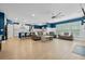 Open living room and kitchen with hardwood floors and ceiling fan at 4041 Oxeye Loop, Johns Island, SC 29455