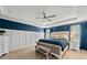 Spacious main bedroom with tray ceiling and white and blue color scheme at 4041 Oxeye Loop, Johns Island, SC 29455