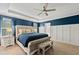 Main bedroom with plush bed and large windows, offering abundant natural light at 4041 Oxeye Loop, Johns Island, SC 29455