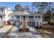 Two-story home with covered porch and circular driveway at 4816 8Th Tee Dr, Hollywood, SC 29449