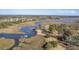 Aerial view of waterfront property with private dock and boat slip at 4816 8Th Tee Dr, Hollywood, SC 29449