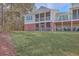 Two-story home with screened porch and grassy backyard at 4816 8Th Tee Dr, Hollywood, SC 29449