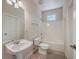 Small bathroom with pedestal sink and tub at 4816 8Th Tee Dr, Hollywood, SC 29449