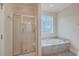 Bathroom with shower and bathtub at 4816 8Th Tee Dr, Hollywood, SC 29449