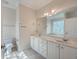Bathroom with double vanity, large mirror, and tile flooring at 4816 8Th Tee Dr, Hollywood, SC 29449