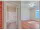 Bedroom with adjacent bathroom and hardwood floor at 4816 8Th Tee Dr, Hollywood, SC 29449
