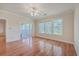 Hardwood floors, ceiling fan and access to balcony at 4816 8Th Tee Dr, Hollywood, SC 29449