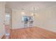 Spacious dining area with hardwood floors and kitchen view at 4816 8Th Tee Dr, Hollywood, SC 29449