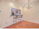 Bright dining room with hardwood floors and kitchen pass-through at 4816 8Th Tee Dr, Hollywood, SC 29449