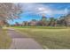Landscaped walking path alongside a lush golf course at 4816 8Th Tee Dr, Hollywood, SC 29449