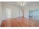 Main bedroom with hardwood floors, private bath access, and balcony access at 4816 8Th Tee Dr, Hollywood, SC 29449