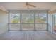 Spacious screened porch with wooden flooring and wooded views at 4816 8Th Tee Dr, Hollywood, SC 29449