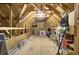 Unfinished attic space with wood framing and storage items at 482 Hidden Meadow Ln, Summerville, SC 29486