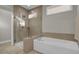 Bathroom with glass shower and soaking tub at 482 Hidden Meadow Ln, Summerville, SC 29486