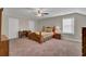 Cozy bedroom with a wooden bed frame and desk at 482 Hidden Meadow Ln, Summerville, SC 29486