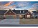 Brick home with a two-car garage and manicured lawn at 482 Hidden Meadow Ln, Summerville, SC 29486