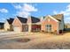 Brick home with a two-car garage and manicured lawn at 482 Hidden Meadow Ln, Summerville, SC 29486