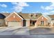 Brick home with two-car garage and landscaped yard at 482 Hidden Meadow Ln, Summerville, SC 29486
