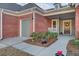 Charming front porch with a rocking chair and landscaping at 482 Hidden Meadow Ln, Summerville, SC 29486