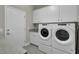 Bright laundry room features washer, dryer, and cabinets at 482 Hidden Meadow Ln, Summerville, SC 29486