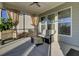 Relaxing screened porch with wicker furniture and ceiling fan at 482 Hidden Meadow Ln, Summerville, SC 29486