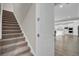 Carpeted staircase with view of kitchen at 482 Hidden Meadow Ln, Summerville, SC 29486