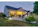 Evening view of house with screened porch and patio at 511 Tidewater Chase Ln, Summerville, SC 29486