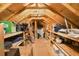 Spacious attic with wooden beams and shelving for storage at 531 Switchgrass Dr, Summerville, SC 29486