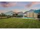 Private backyard pool with a large grassy area and privacy fence at 531 Switchgrass Dr, Summerville, SC 29486