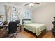 Bright bedroom with built-in desk, full-size bed, and hardwood floors at 531 Switchgrass Dr, Summerville, SC 29486