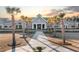 Community center with a grand entrance and palm tree landscaping at 531 Switchgrass Dr, Summerville, SC 29486