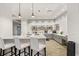 Bright community kitchen features modern appliances and an island with seating at 531 Switchgrass Dr, Summerville, SC 29486